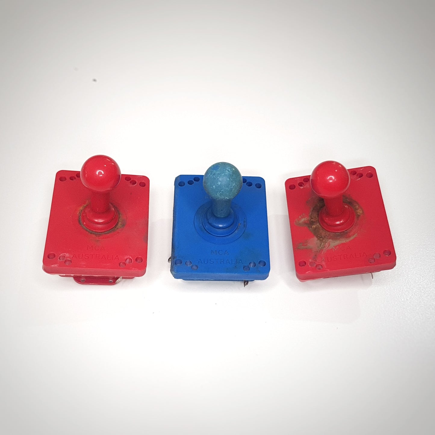 Vintage joysticks, assorted buttons and various parts