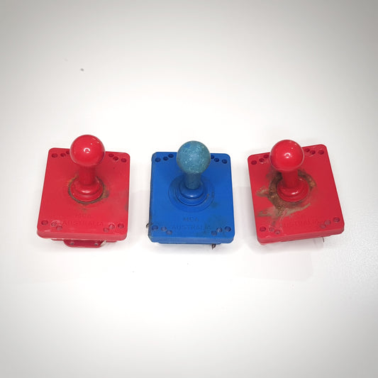 Vintage joysticks, assorted buttons and various parts