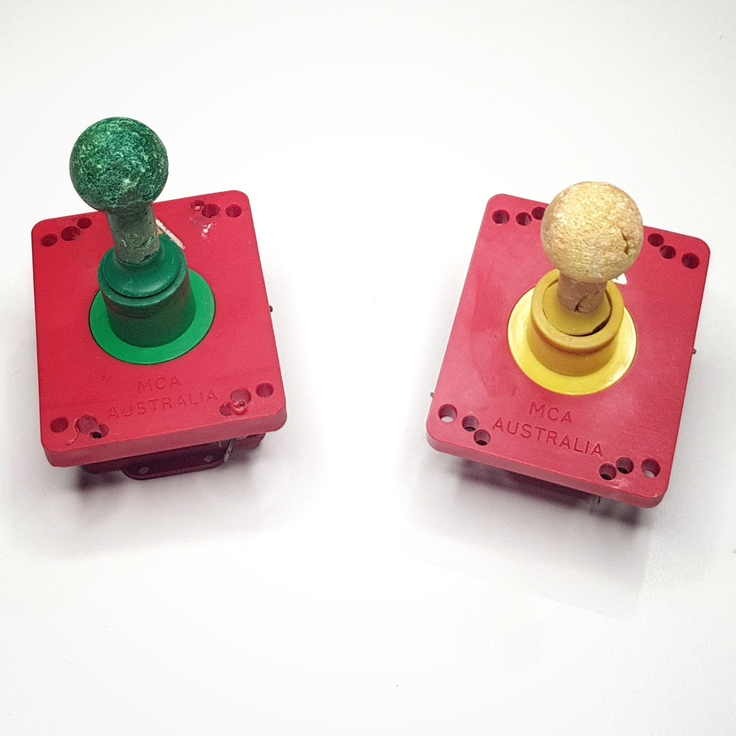 Vintage joysticks, assorted buttons and various parts