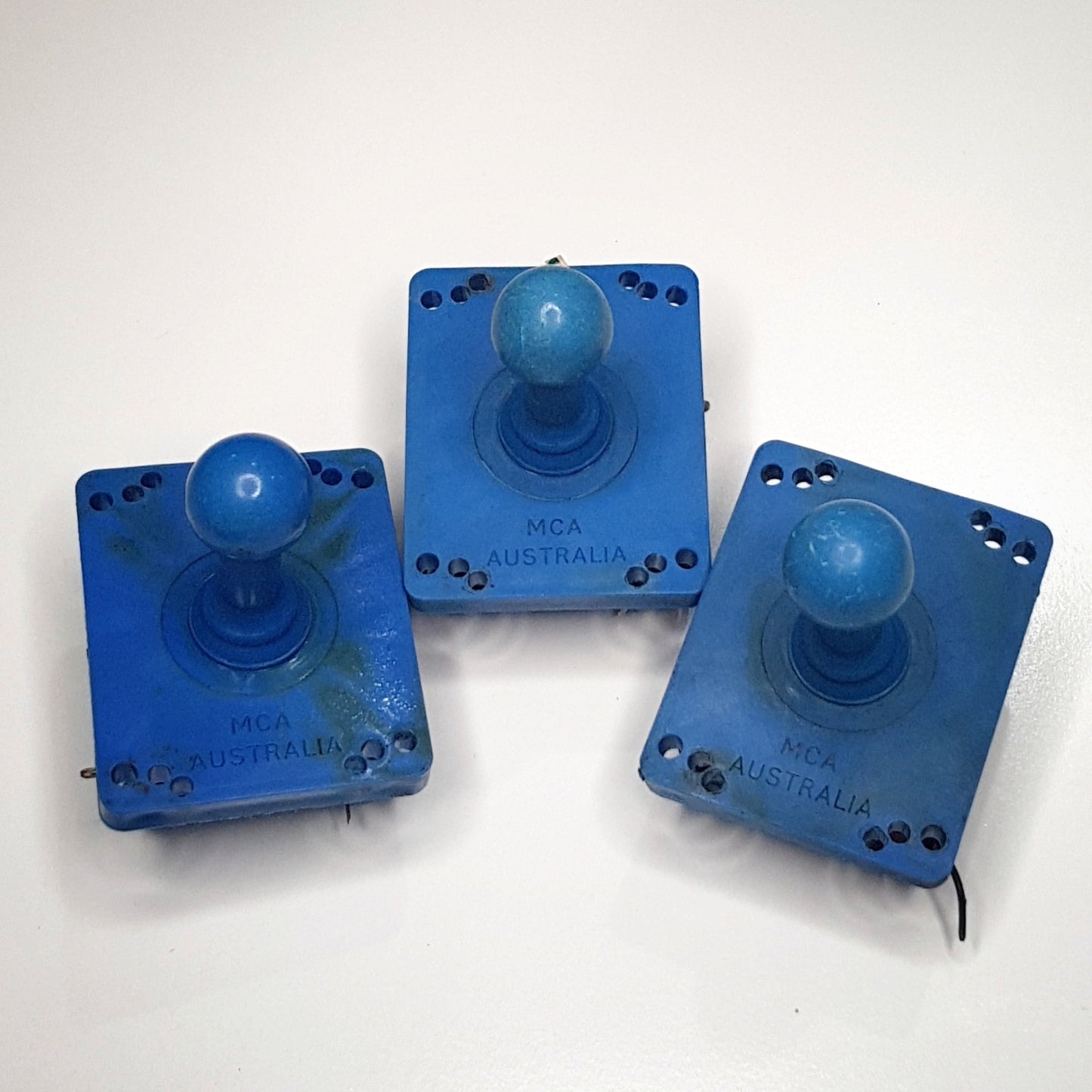 Vintage joysticks, assorted buttons and various parts